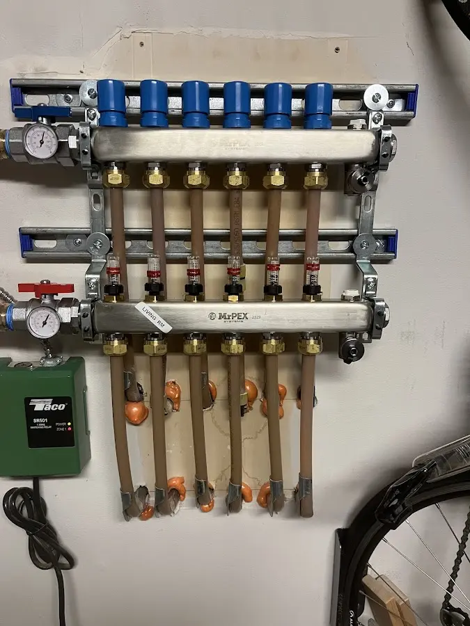 Plumber performing Water Heater Repair at a residential property in St. Andrews